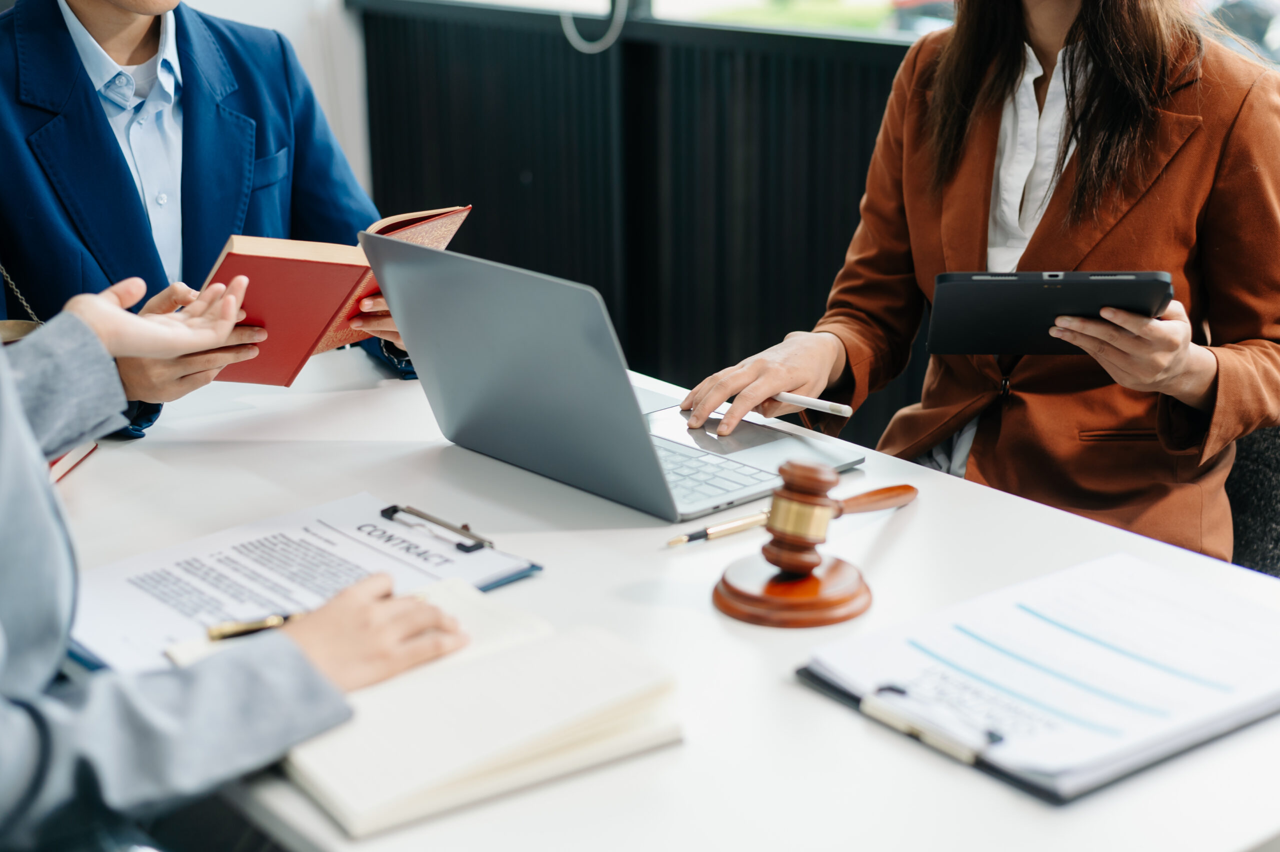 business people and lawyers discussing contract papers sitting at the table. Concepts of law, advice, legal services. in morning light